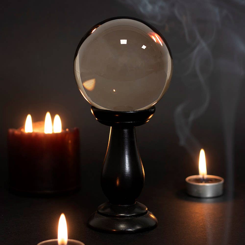 Petite boule de cristal gris fumé sur socle