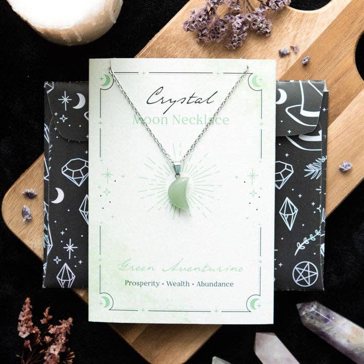 Collier lune d'aventurine verte sur carte de vœux