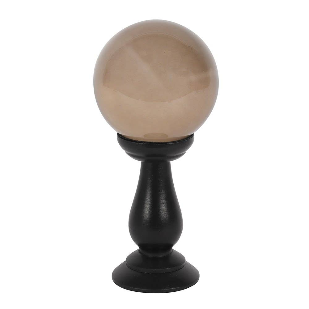 Petite boule de cristal gris fumé sur socle