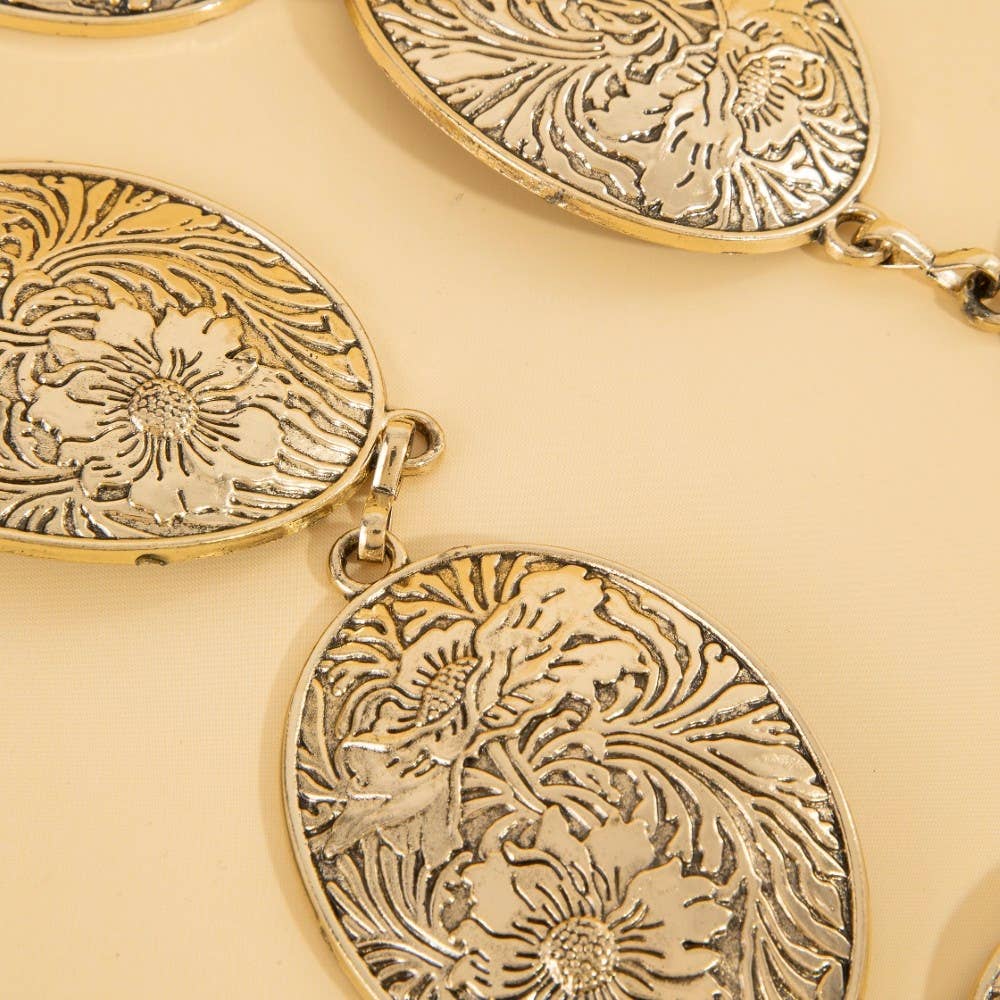 Ceinture concho ovale gravé de fleurs