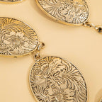 Ceinture concho ovale gravé de fleurs