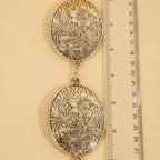 Ceinture concho ovale gravé de fleurs