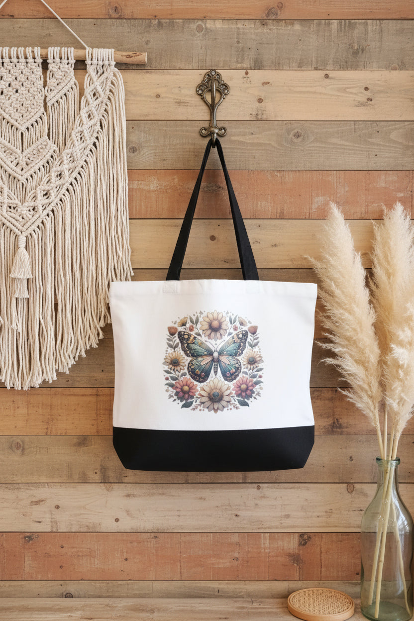 Sac réutilisable blanc et noir avec illustration colorée de papillon et fleurs.